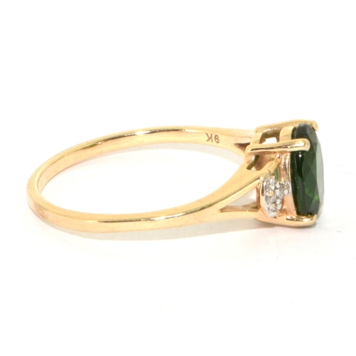 225 - 9ct gold ladies Diamond and Emerald colour centre stone ring size  S