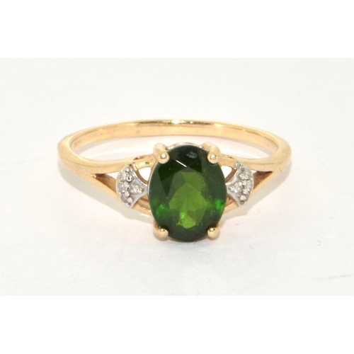 225 - 9ct gold ladies Diamond and Emerald colour centre stone ring size  S