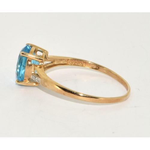 229 - 9ct gold ladies Diamond and Blue Topaz ring size Z