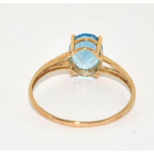 229 - 9ct gold ladies Diamond and Blue Topaz ring size Z