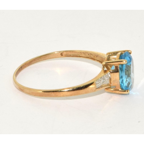 229 - 9ct gold ladies Diamond and Blue Topaz ring size Z