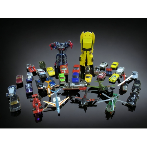 527 - A QUANTITIY OF MIXED DIE CAST CARS, AEROPLANES, HELICOPTERS & TRANSFORMERS.