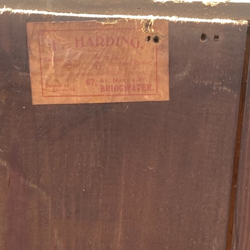 31 - A 19TH CENTURY MAHOGANY GLAZED WALL HANGING CABINET. WITH MANUFACTURER'S LABEL.