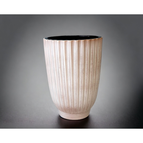 419 - A NORMAN WILSON FOR WEDGWOOD VASE. GLAZED, RIBBED FORM.
HEIGHT - 22CM