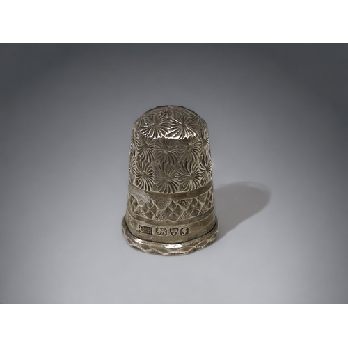 262 - A CHARLES HORNER STERLING SILVER THIMBLE, CHESTER HALLMARKS. TOGETHER WITH A STERLING SILVER CELTIC ... 