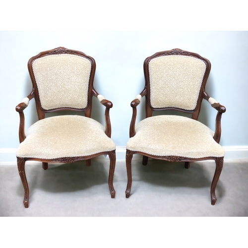 37 - A PAIR OF CARVED ROSEWOOD CARVER CHAIRS. UPHOLSTERED IN A CHAMPAGNE PATTERN VELVET. CARVED FOLIATE D... 