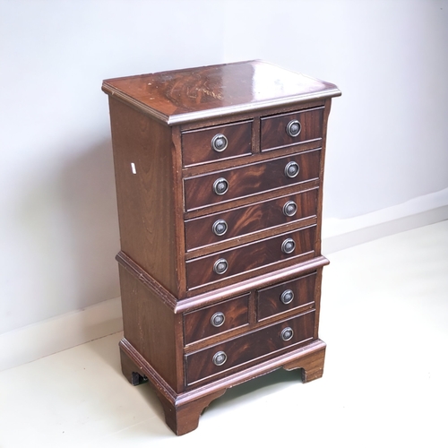 38 - A SMALL VINTAGE MAHOGANY CHEST ON CHEST. SET WITH 8 VENEERED DRAWERS.