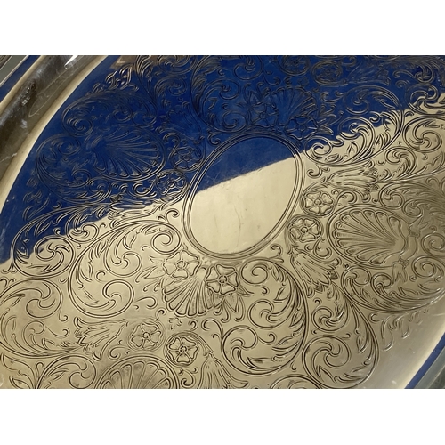 477 - A LARGE ENGRAVED ONEIDA SILVER PLATE HANDLES TRAY.