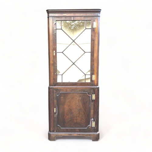 63 - A 19TH CENTURY MAHOGANY GLAZED CORNER CABINET.