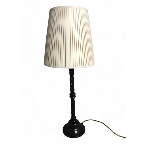 507 - A TALL ANTIQUE METAL BARLEY TWIST LAMP AND SHADE