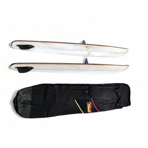 513 - A SET OF SILVER STREAK SKI'S AND COVER