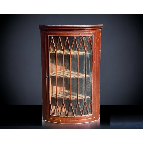 10 - A 19TH CENTURY MAHOGANY GLAZED WALL HANGING CABINET. WITH MANUFACTURER'S LABEL.