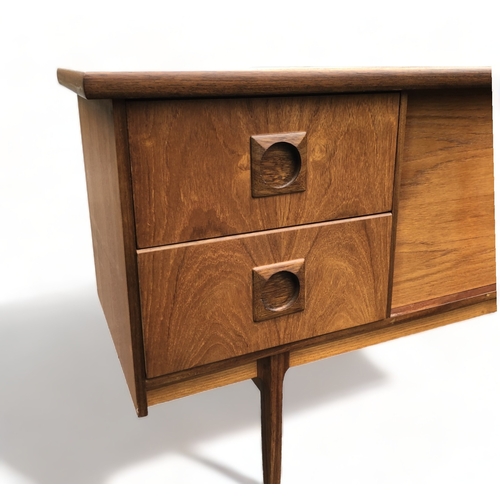 48 - A MID-CENTURY TEAK SIDEBOARD. CENTRAL SLIDING DOORS FLANKED BY PAIRS OF DRAWERS.