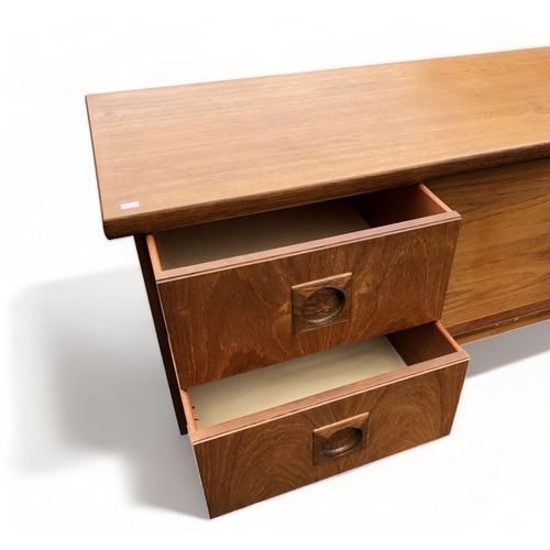 48 - A MID-CENTURY TEAK SIDEBOARD. CENTRAL SLIDING DOORS FLANKED BY PAIRS OF DRAWERS.