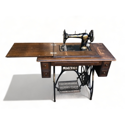 54 - A JONES MEDIUM CS  SEWING MACHINE WITH TABLE. WITH DRAWERS. CIRCA 1914.