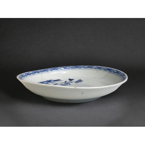 7 - A CHINESE EXPORT PORCELAIN DISH. 
QIANLONG PERIOD. 
PAINTED ROCKY OUTCROP. 
11CM DIAMETER.