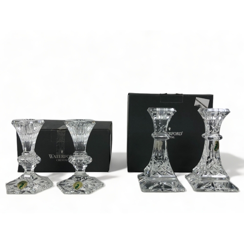 250 - TWO BOXED PAIRS OF WATERFORD CRYSTAL CANDLESTICKS.