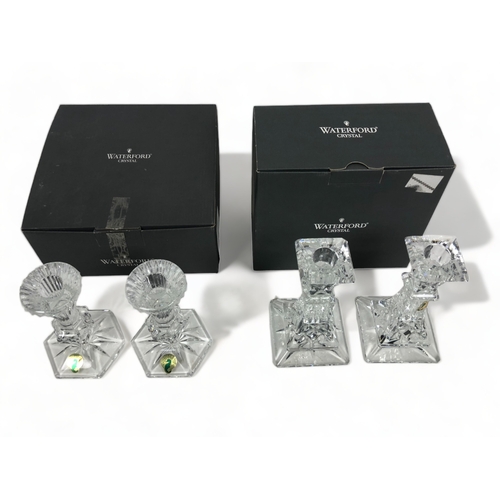 250 - TWO BOXED PAIRS OF WATERFORD CRYSTAL CANDLESTICKS.