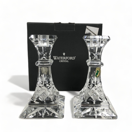 250 - TWO BOXED PAIRS OF WATERFORD CRYSTAL CANDLESTICKS.