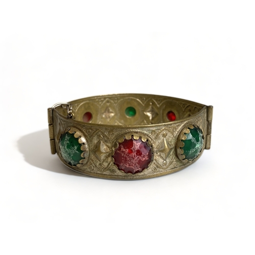 269 - A vintage Tibetan engraved cuff bracelet, together with one other.