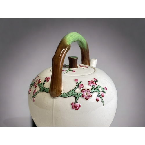 552 - A SCARCE CHRISTOPHER DRESSER FOR MINTON PORCELAIN TEAPOT. CIRCA 1872.
RELIEF DECORATED JAPONESQUE CH... 