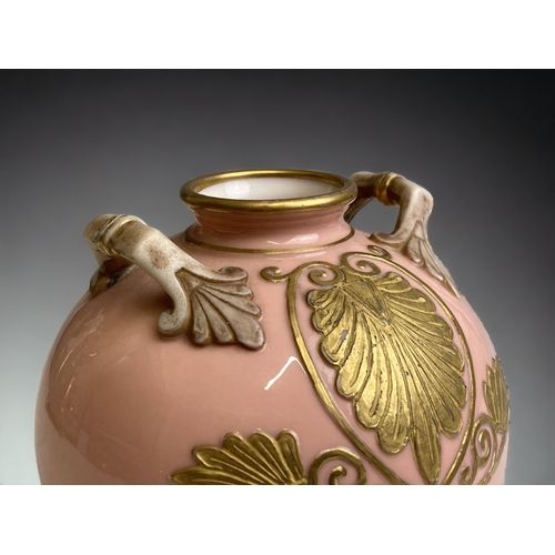 554 - A 19TH CENTURY PORCELAIN GLOBULAR FORM VASE. BABY PINK GROUND WITH GILT OVERLAY DESIGN. 
HEIGHT - 10... 