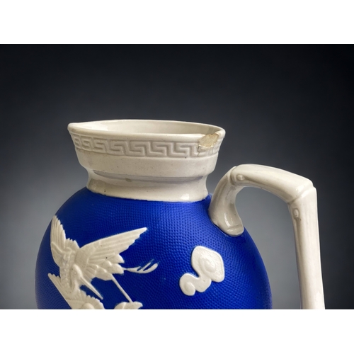 557 - A CHRISTOPHER DRESSER DESIGN FOR W. BROWNFIELD STONEWARE 'YEDDO' JUG. 
CIRCA 1876.
HEIGHT - 15CM