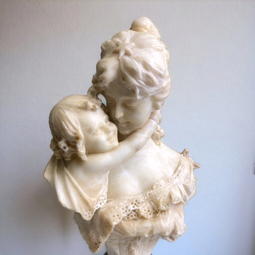 516 - A LARGE ITALIAN CARVED ALABASTER BUST OF MOTHER & CHILD.  MOUNTED ON GREY MARBLE SOCLE BASE. SIGNED ... 