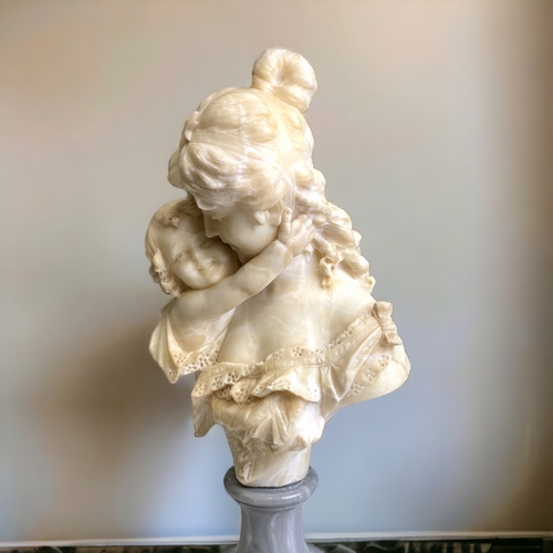 516 - A LARGE ITALIAN CARVED ALABASTER BUST OF MOTHER & CHILD.  MOUNTED ON GREY MARBLE SOCLE BASE. SIGNED ... 