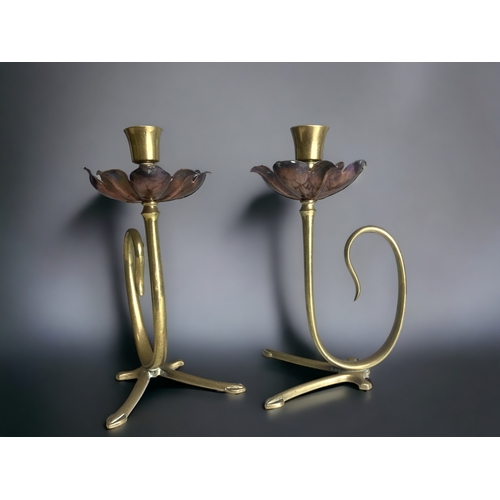 517 - A pair of W.A.S Benson Arts & Crafts candlesticks. 
Copper & Brass flower design.
Unmarked.
Height -... 