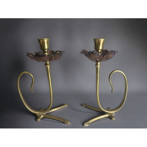 517 - A pair of W.A.S Benson Arts & Crafts candlesticks. 
Copper & Brass flower design.
Unmarked.
Height -... 