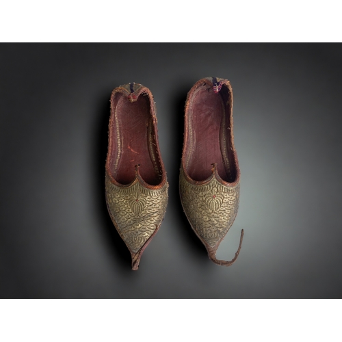 693 - A pair of Persian hand made children's shoes. 
length - 20cm