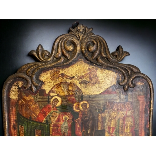 602 - A large 19th century Religious Icon.
Painted on board, with carved frame. 
55 x 37 cm