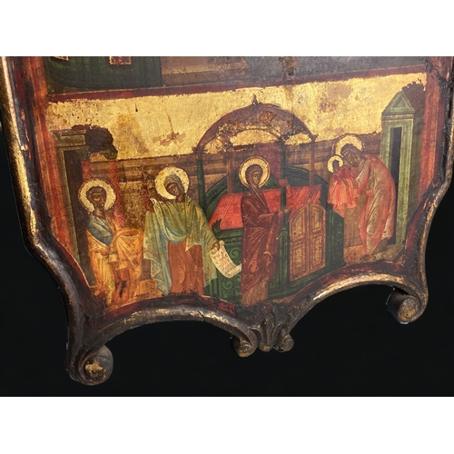 602 - A large 19th century Religious Icon.
Painted on board, with carved frame. 
55 x 37 cm