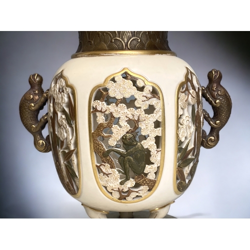 613 - A Royal Worcester Aesthetic porcelain vase. 
Reticulated Japanese inspired design, depicting a Monke... 