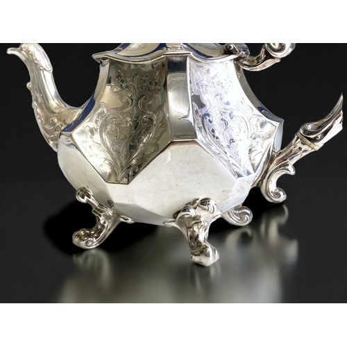 512 - A Sterling Silver Rococo style teapot. 
By Angel brothers (Joseph Angell I & Joseph Angell II). Lond... 