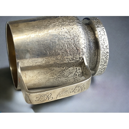 590 - A rare Guy Wilson sterling silver mug.
Bark effect design with inset cabochon to handle.
Makers mark... 