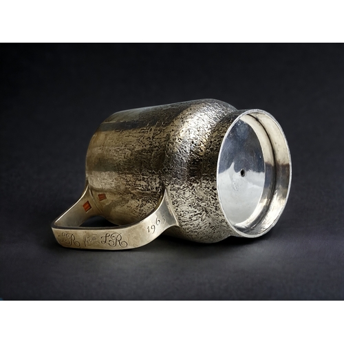 590 - A rare Guy Wilson sterling silver mug.
Bark effect design with inset cabochon to handle.
Makers mark... 