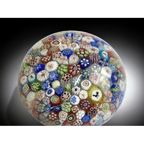 664 - A scarce Baccarat close packed Millefiori Paperweight. 
'B' mark & 1848 worked into a cane.