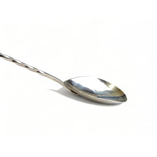 644 - An Arts & crafts sterling silver twist-stem handle spoon. With inset gem.