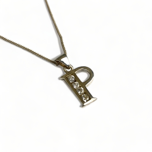 629 - Boxed silver and paste initial letter 'P' necklace.