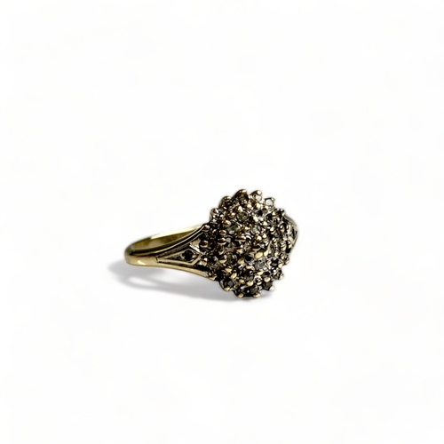 630 - A boxed 9CT Gold & Diamond cluster ring, approx. 0.25cts total.
Size K.