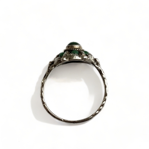 635 - An unusual silver and malachite cluster ring, possibly Chinese or Tibetan, size Q. 
Unmarked but tes... 