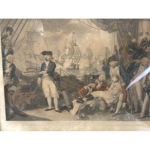 653 - A large gilt framed coloured lithograph.
'The battle of the Glorious first of June 1794'.
75 x 62 cm