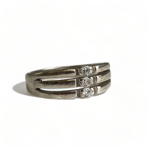 637 - A Sterling silver and three white stone triple band effect ring, size R. 
Italian hallmarked and rem... 