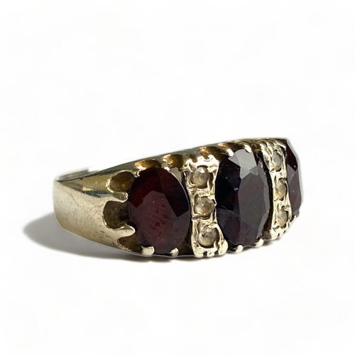 639 - Sterling silver brutalist garnet and paste ring, size O, Birmingham 1978.