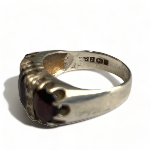 639 - Sterling silver brutalist garnet and paste ring, size O, Birmingham 1978.