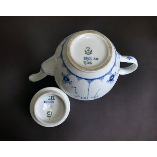 658 - A Royal Copenhagen 'Blue fluted half lace' pattern part tea set. Including Tea pot, 6 teacups, break... 