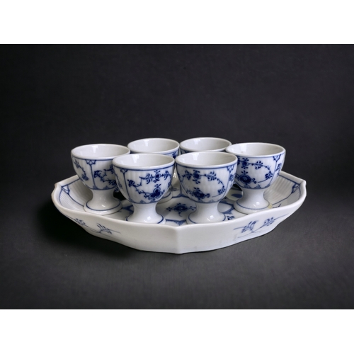 660 - Royal Copenhagen 'blue fluted half lace' set of six egg cups, with stand.