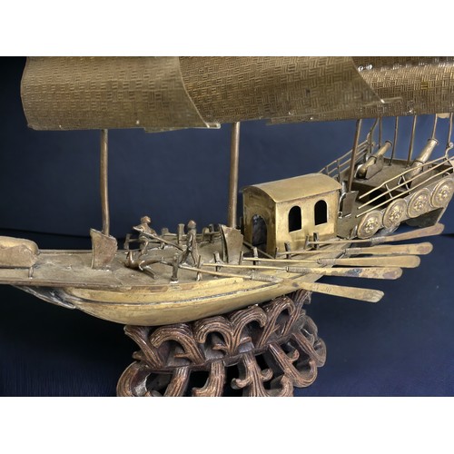 25 - Large Chinese brass model of a junk on the water.